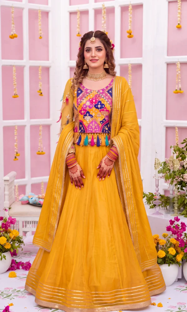 Mustard Yellow Lehenga Choli with Multicolored Patchwork Bodice and Tassels