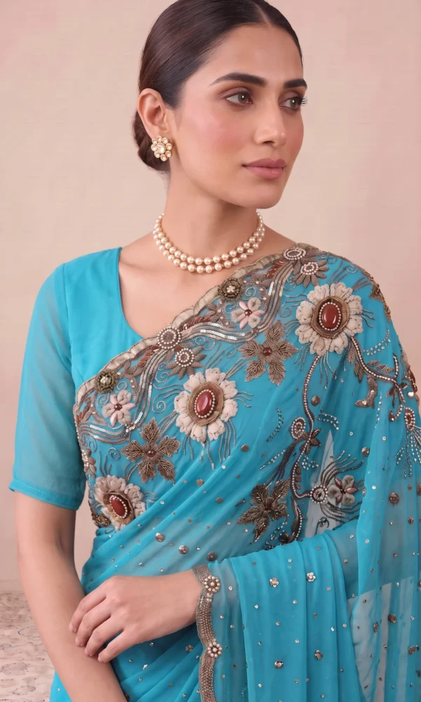 Turquoise Blue Stone-Embellished and Zari-Work Net Saree with Scalloped Border and Matching Blouse – Luxury Wedding & Reception Wear